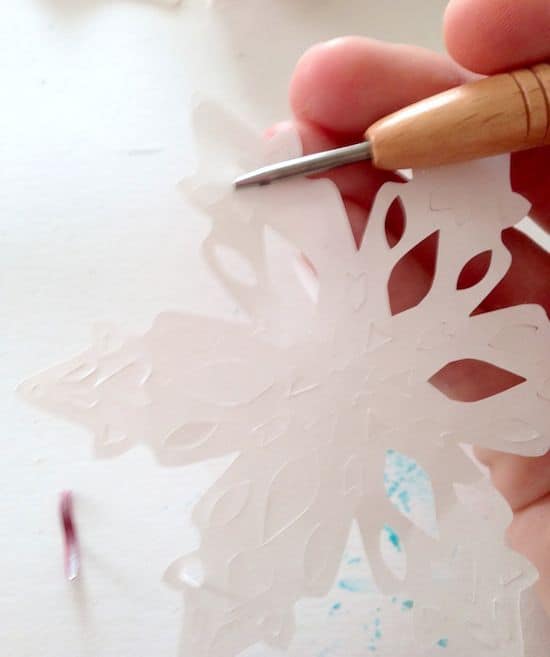 Punching the chads out of paper snowflakes