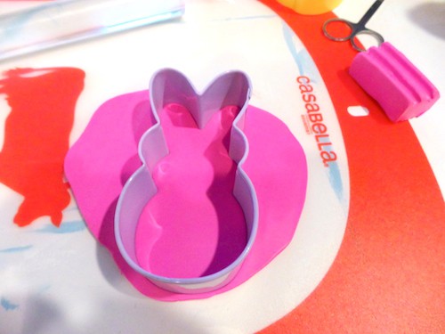 Cutting out clay with a bunny Peep cookie cutter