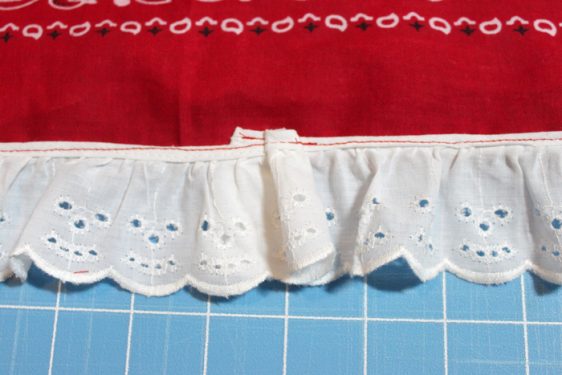 Sewn lace on the edge of a girls fourth of july skirt