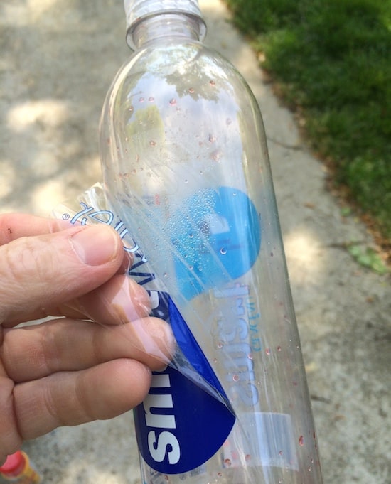 Removing labels from plastic bottles