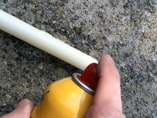 Spraying cooking spray at the end of a wax candle