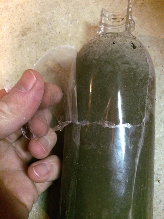 Removing the plastic bottle from a concrete candle holder