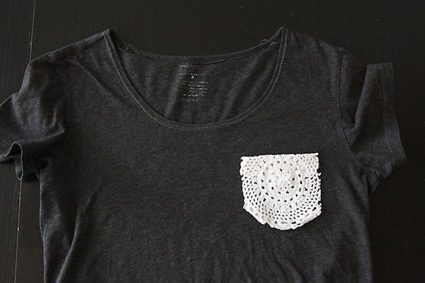Doily pocket laying on top of a gray t shirt