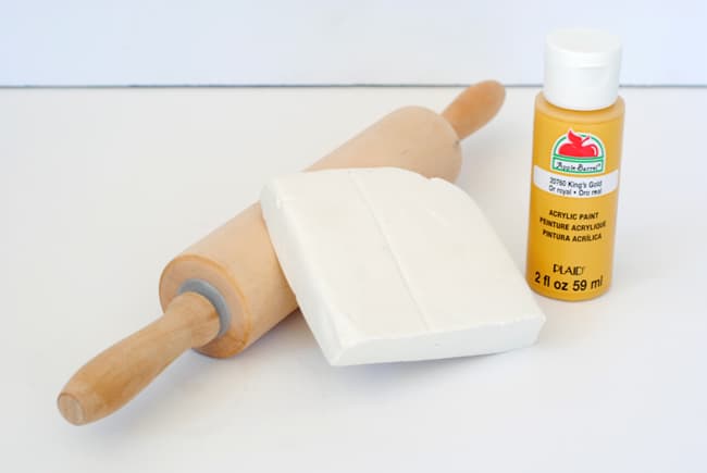 Air dry clay, yellow paint, and a rolling pin
