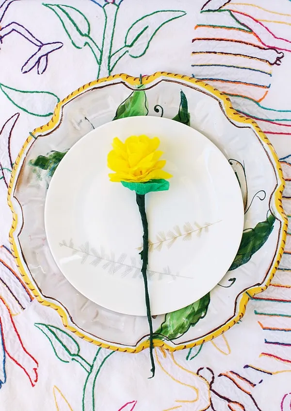 DIY crepe paper flower in the center of a white plate