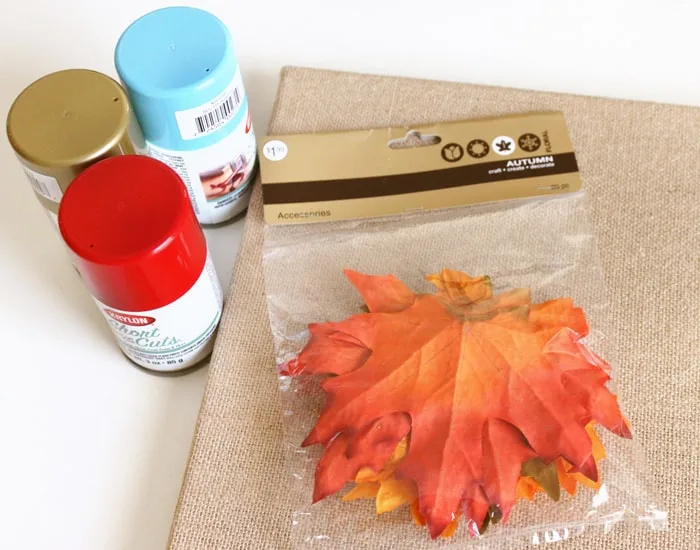 Burlap canvas, leaves, spray paint in red, blue, and gold