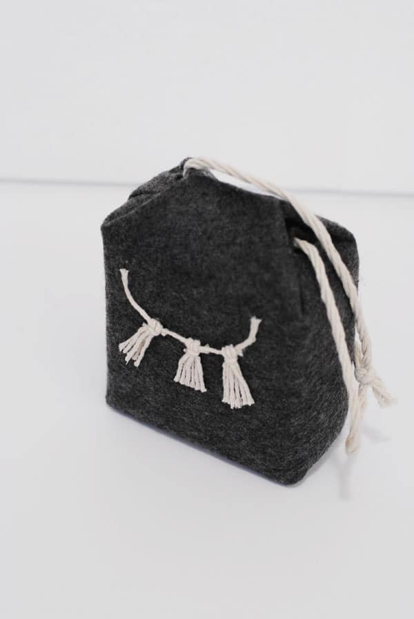 9 - completed felted milk carton doorstop with string garland