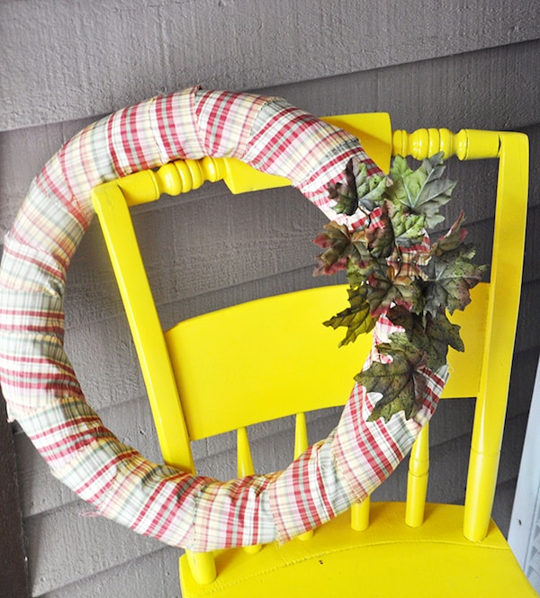 Make a budget friendly DIY fall wreath from a pool noodle! So cute!
