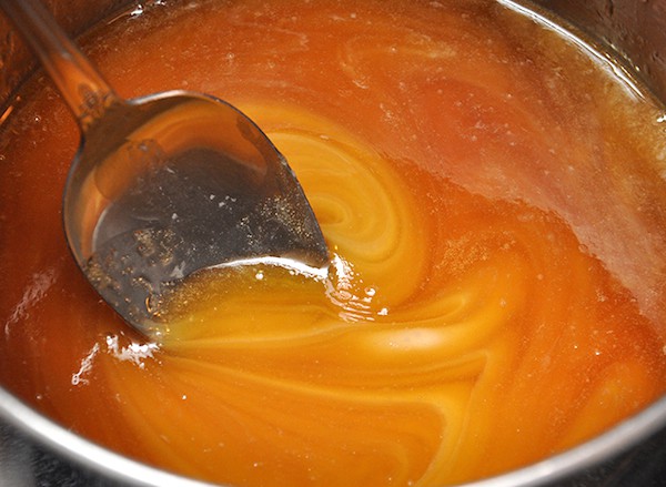 Stir sweetened condensed milk into a mixture of brown sugar and butter in a saucepan