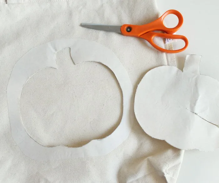 Pumpkin shape cut out of the tote with scissors