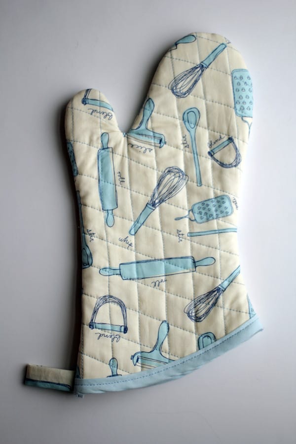 Quilted DIY pot holder sewn out of fun kitchen fabric!