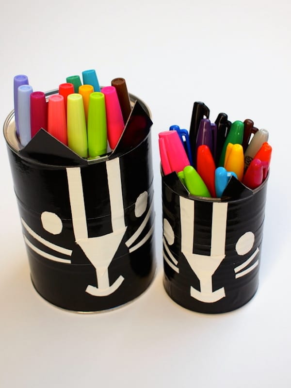 Learn how to make these black cat containers with duct tape - kids will love this Halloween craft!