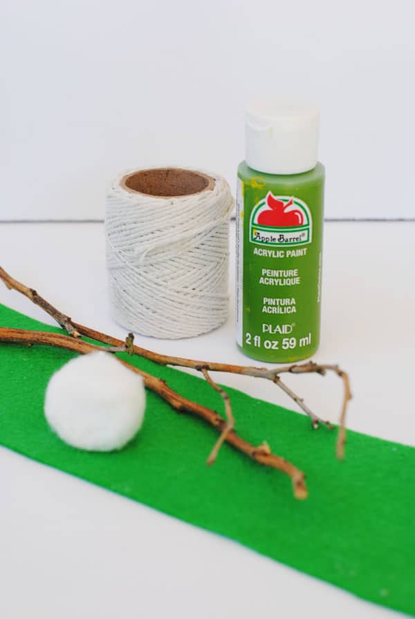 Twigs, cotton thread, green paint, cotton ball, and green felt