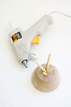 Chopsticks glued to the bottom of the wooden bowl