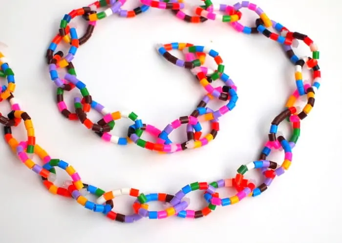 Several perler bead loops added together to form a chain