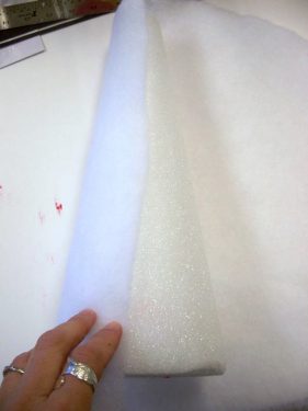 Wrapping a piece of quilt batting around a foam cone