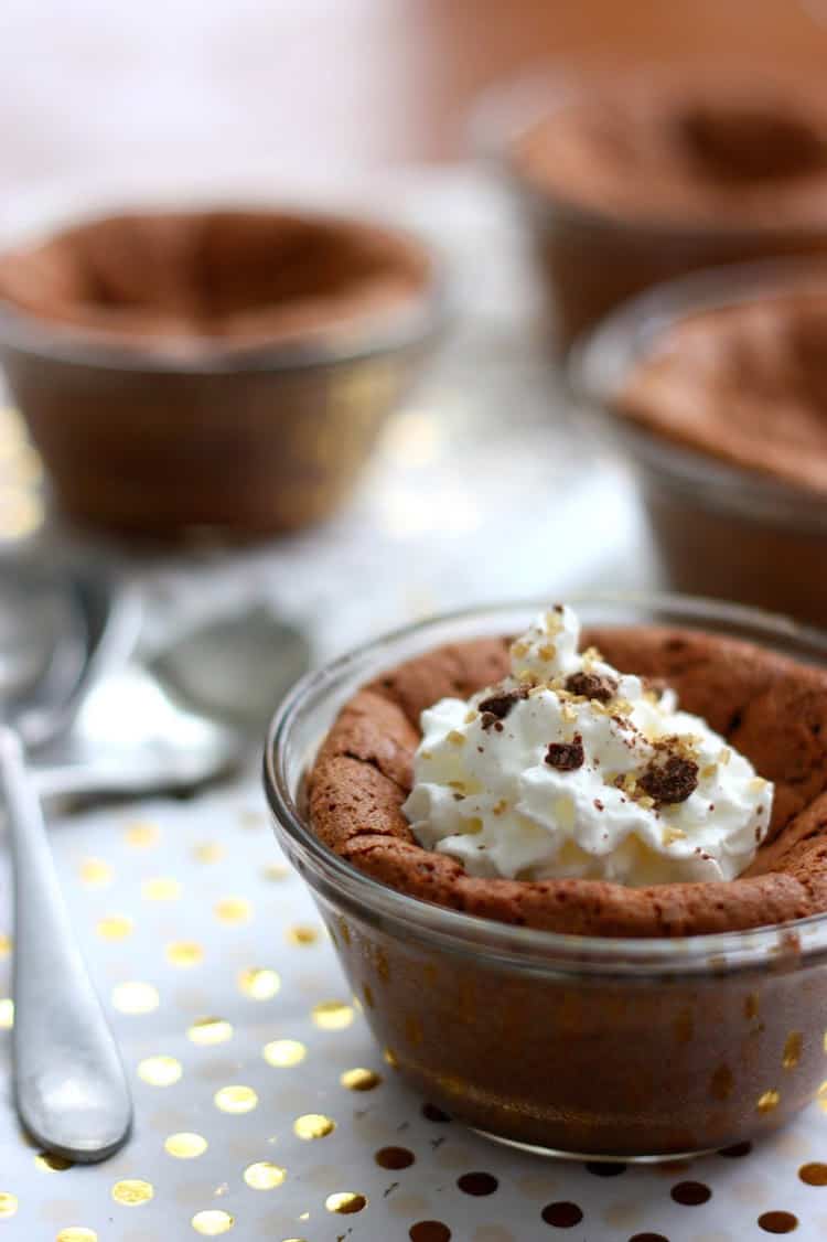 Baked pudding in glass dishes with whipped cream