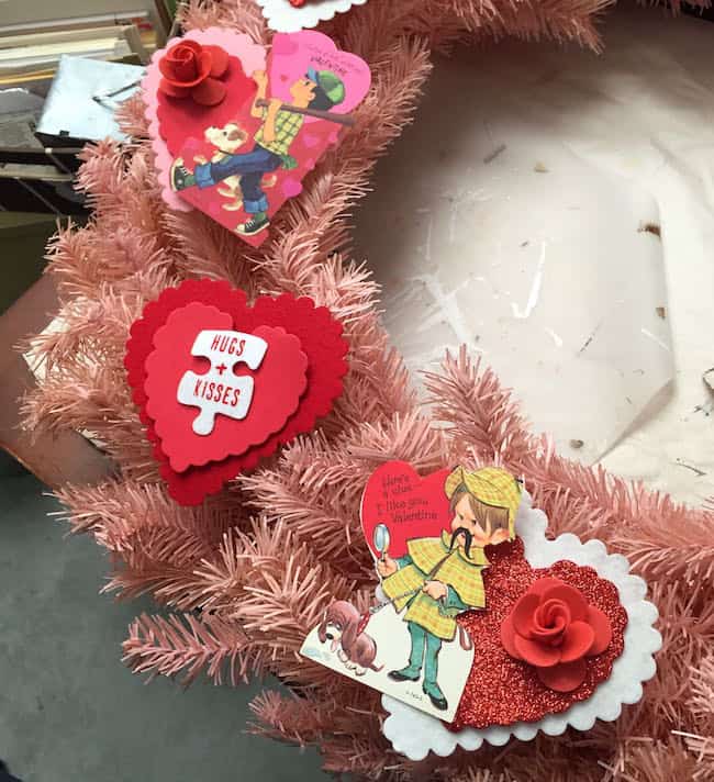 Layered valentines and hearts on top of a wreath base