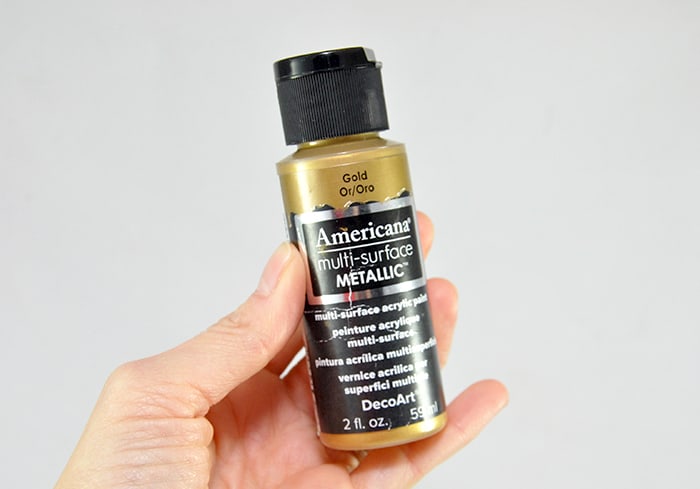 Bottle of gold multi-surface metallic paint