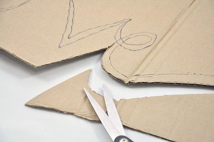 Cutting cardboard with scissors