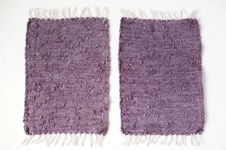 Two purple placemats laying next to each other
