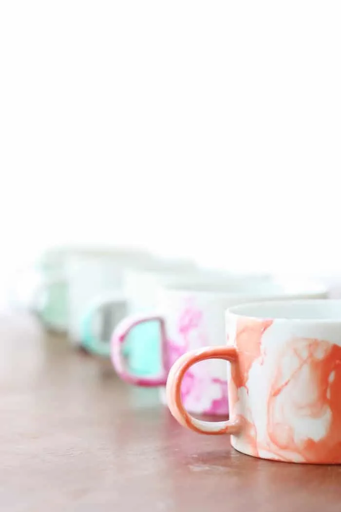 Set of DIY mugs made with nail polish