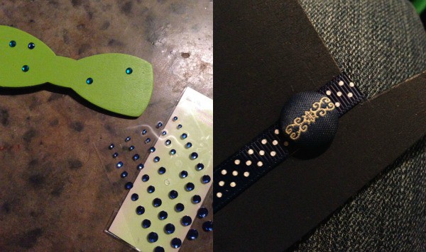 Adding embellishments like ribbon and adhesive gems to photo booth props