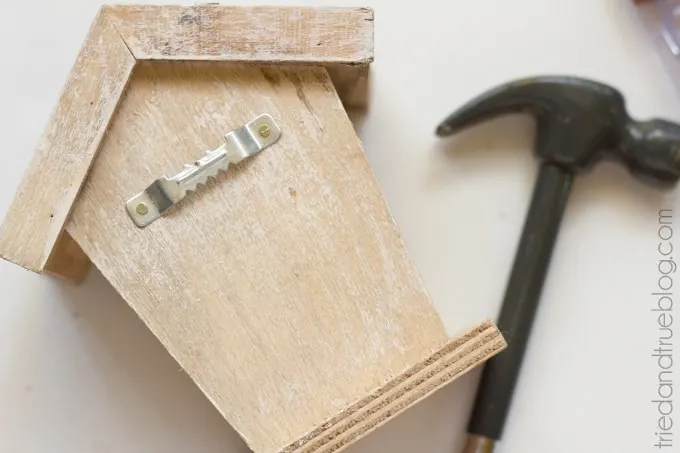 Sawtooth hanger nailed to the back of the birdhouse