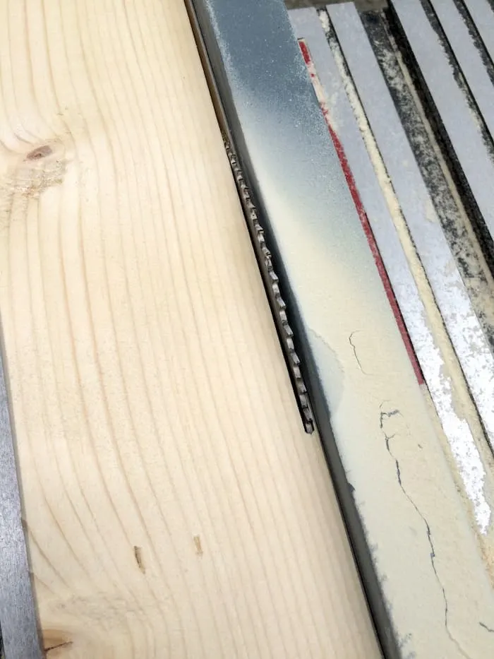 Cutting pine boards on a table saw
