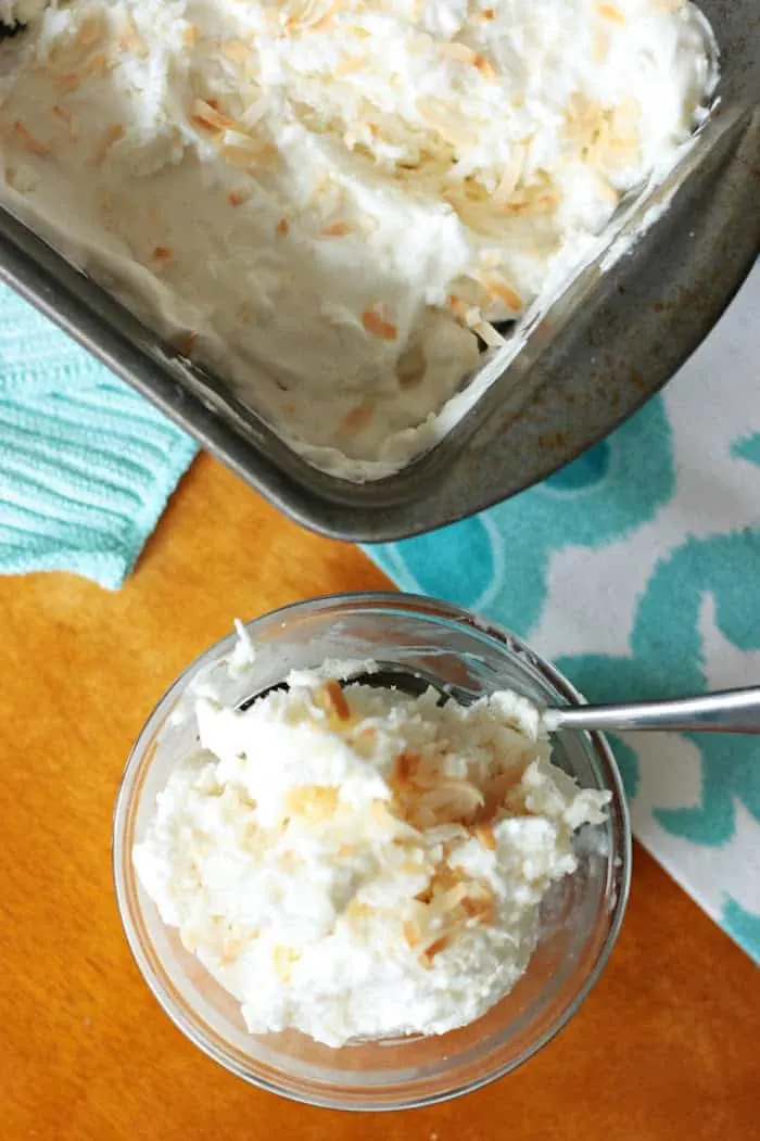 Delicious coconut ice cream recipe being scooped into a bowl