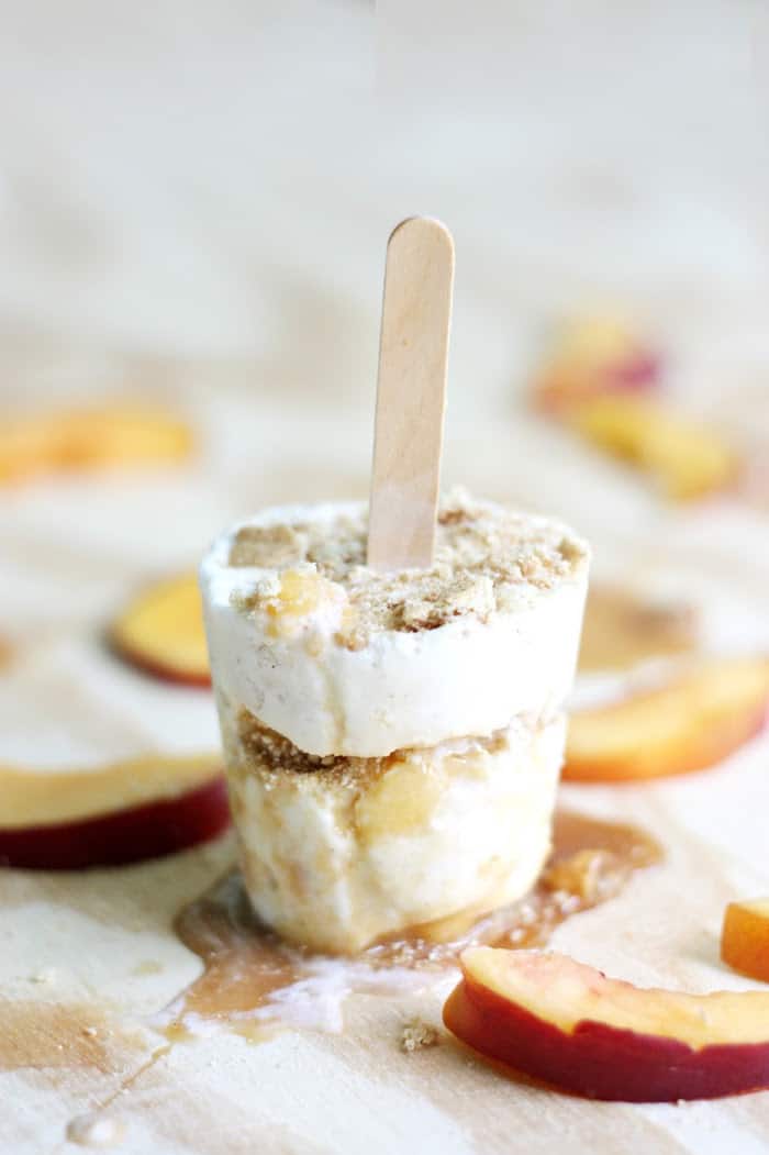 This popsicle recipe combines all the best parts of peach pie and ice cream with the deliciousness of rich honey caramel sauce. A perfect sweet treat!