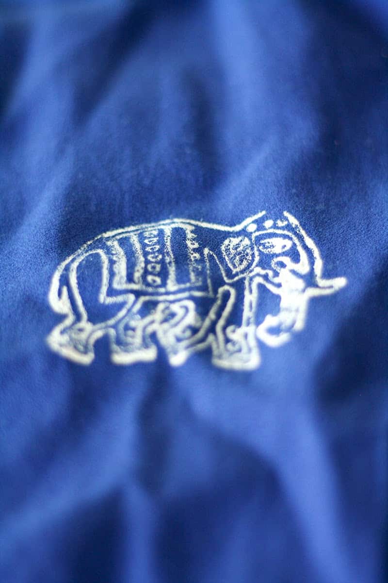 Elephant design stamped onto blue fabric