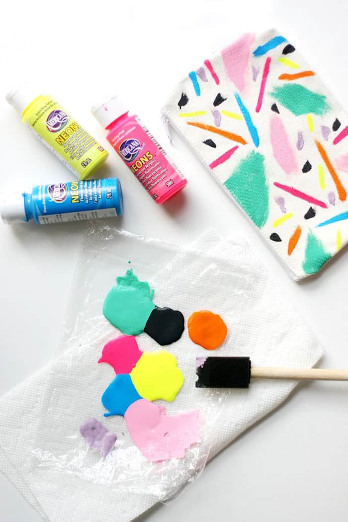 Craft paint with a foam brush on a piece of plastic wrap