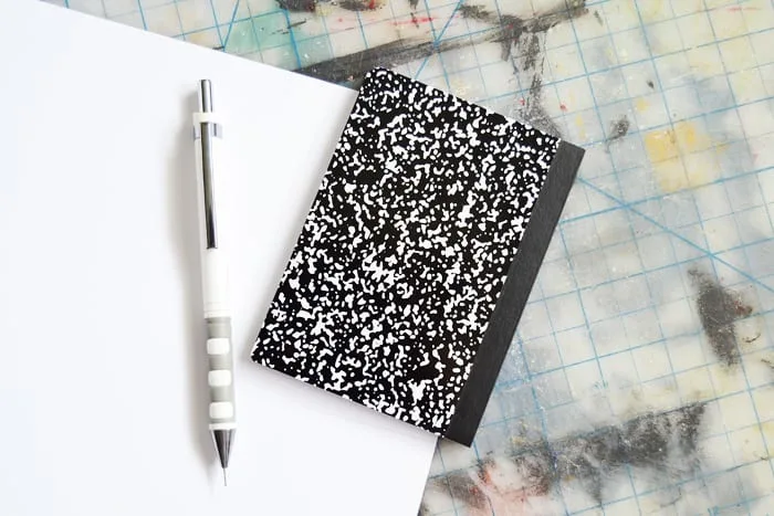 Tracing a notebook on a piece of scrapbook paper