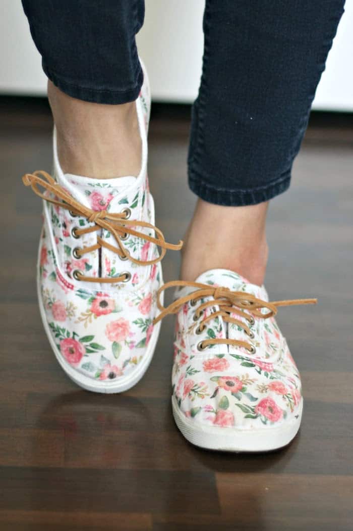 White canvas shoes decorated with a floral iron on transfer