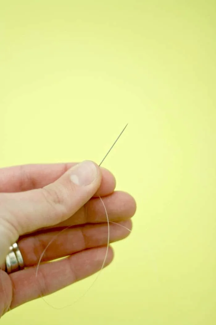 Needle threaded with fishing line
