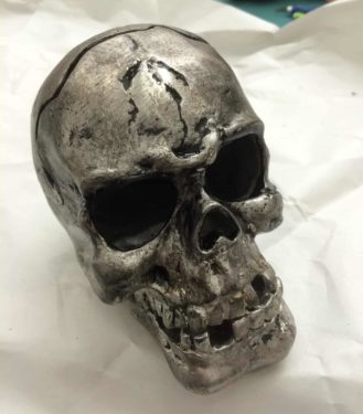 Skull with black paint wiped away