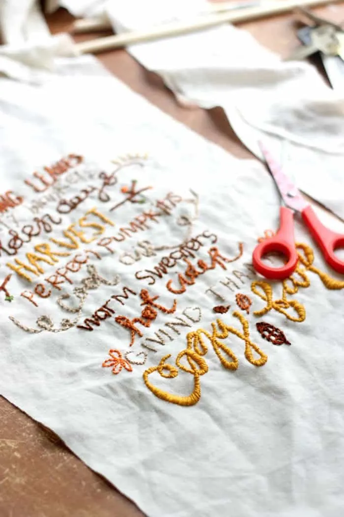 This pretty DIY wall hanging is embroidered with a fun fall theme! Our has a rustic touch but you can customize yours any way you like.