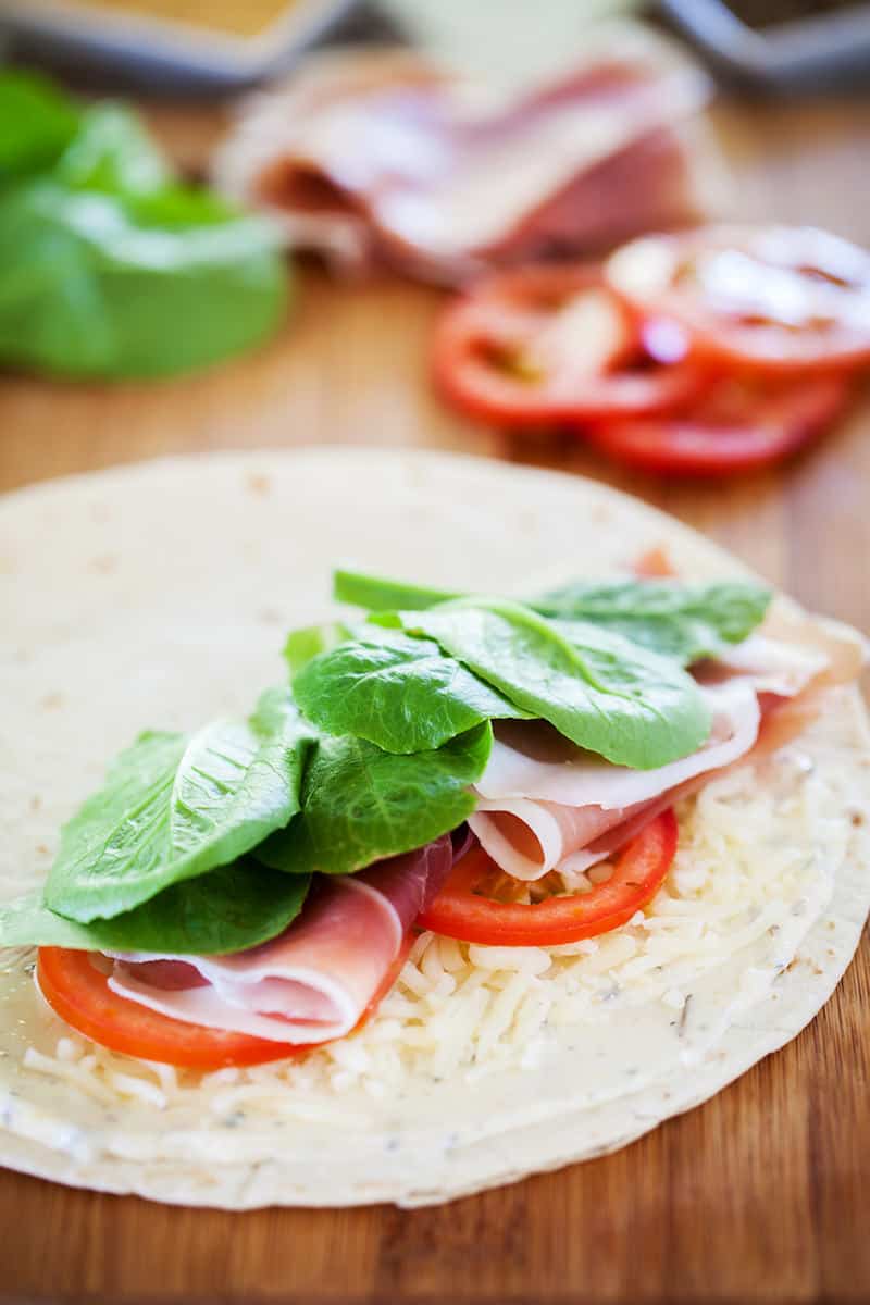 This quesadilla recipe is packed with flavor. Savory prosciutto, juicy tomatoes, crunchy kale and cheesy mozzarella on top of garlic butter - delicious!