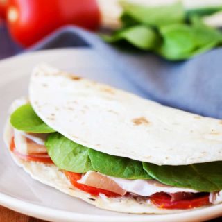 This quesadilla recipe is packed with flavor. Savory prosciutto, juicy tomatoes, crunchy kale and cheesy mozzarella on top of garlic butter - delicious!