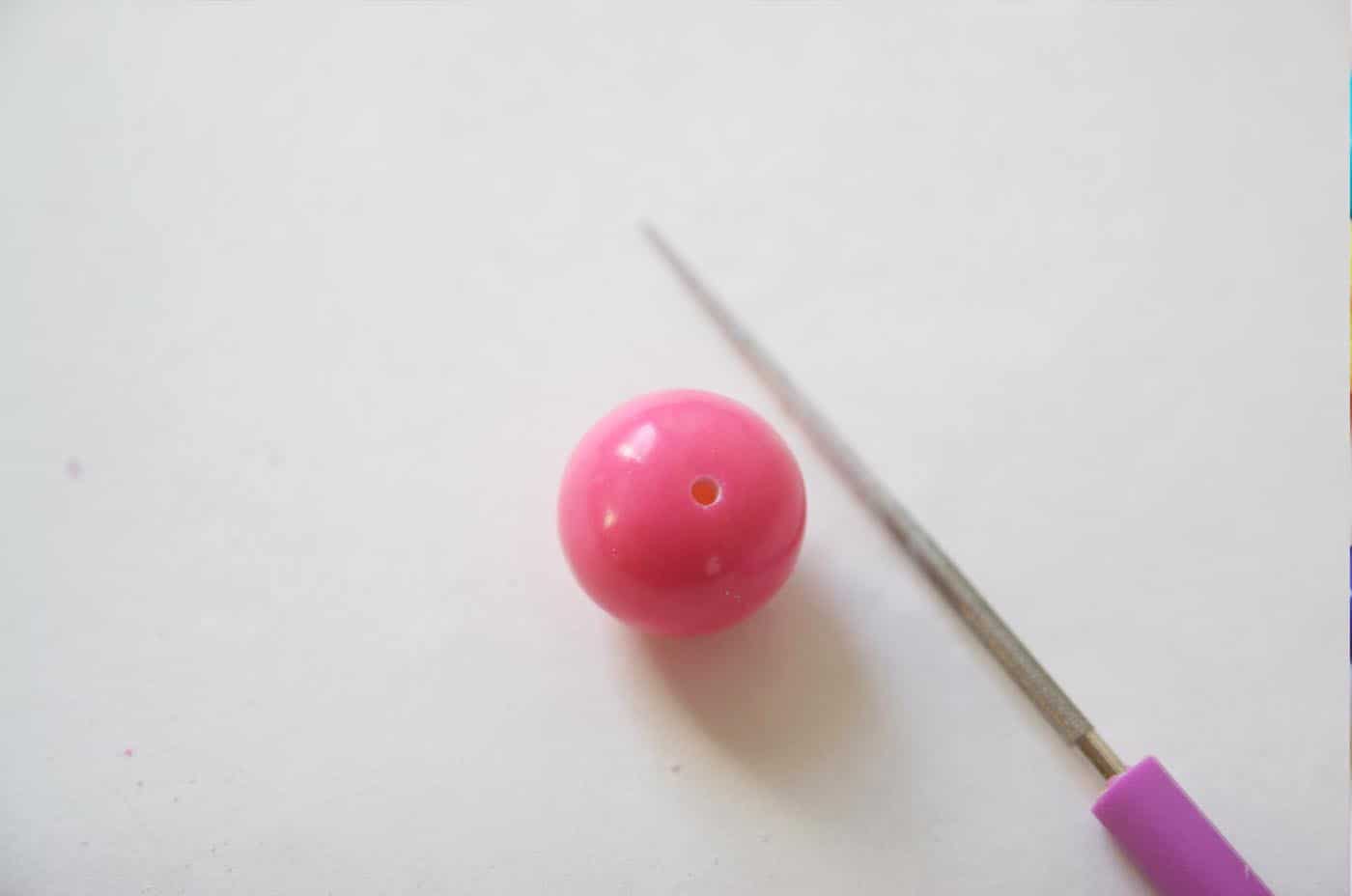 Gumball pierced with an awl