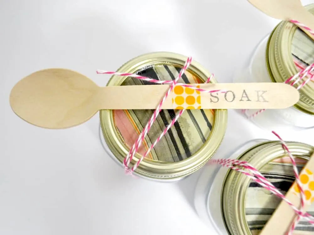 DIY bath salts with baking soda - in a mason jar with a wooden spoon tied on a top
