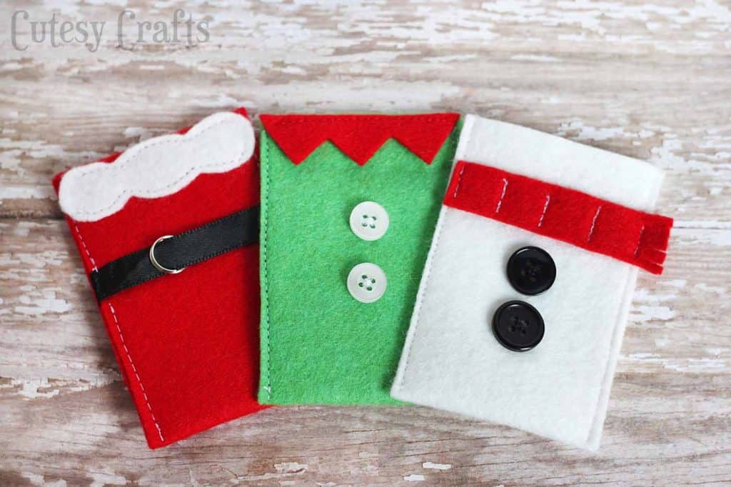 To make gift card giving a little more fun this year, I made these felt gift card holders. There's a Santa, a snowman, and an elf! Aren't they cute?!