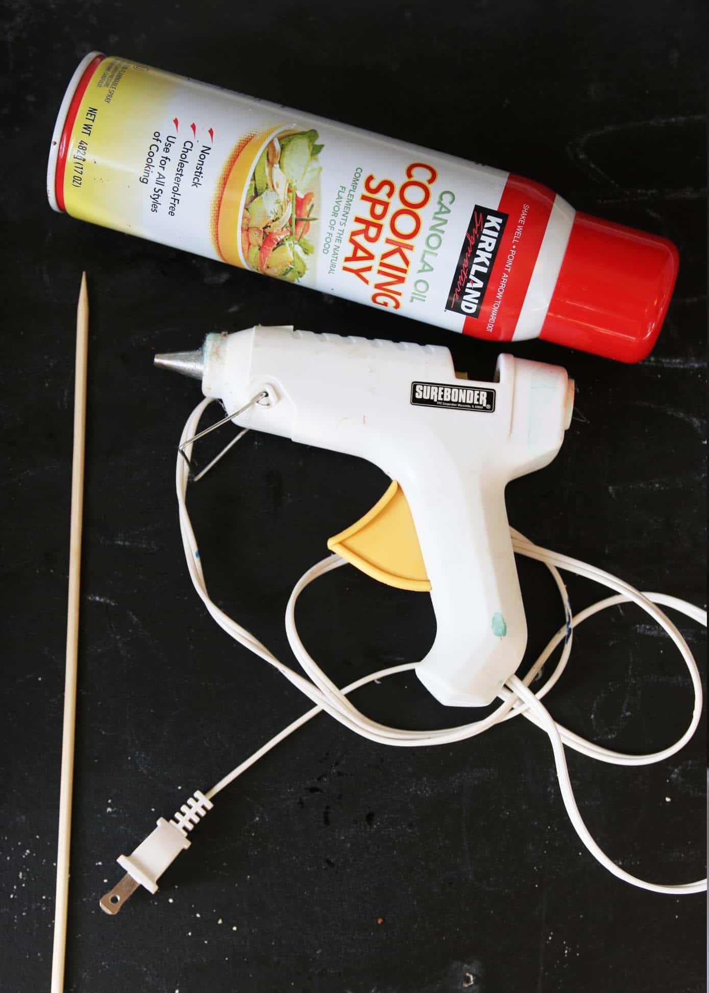 Cooking spray, hot glue gun, and a skewer