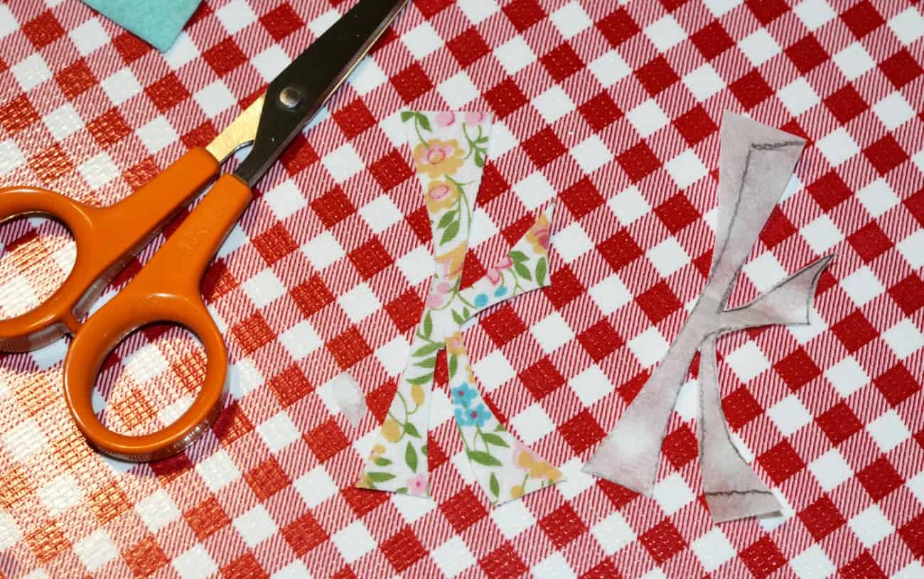 Pair of scissors, cut fabric, and cut steam a seam sheet