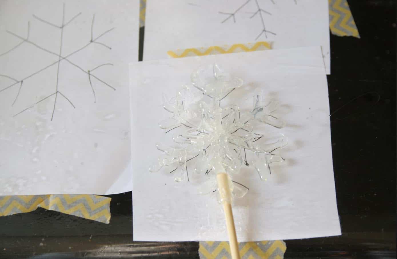 Hot glue painted in the shape of a snowflake using a template