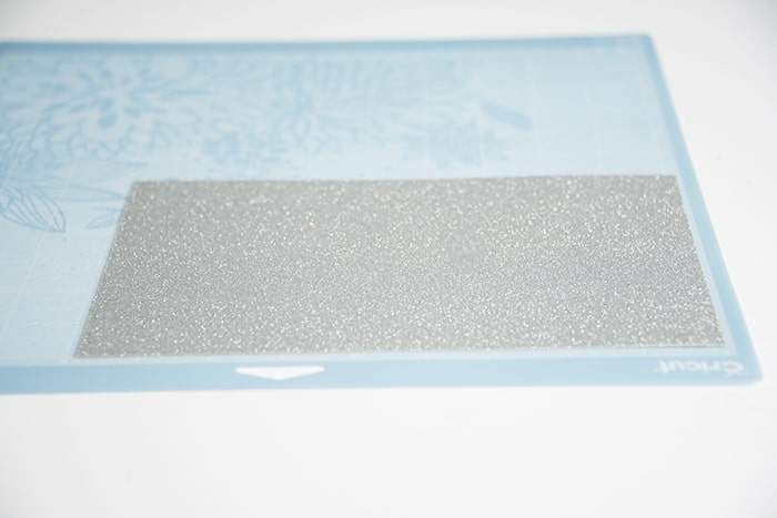 Glitter cardstock stuck to a Cricut mat