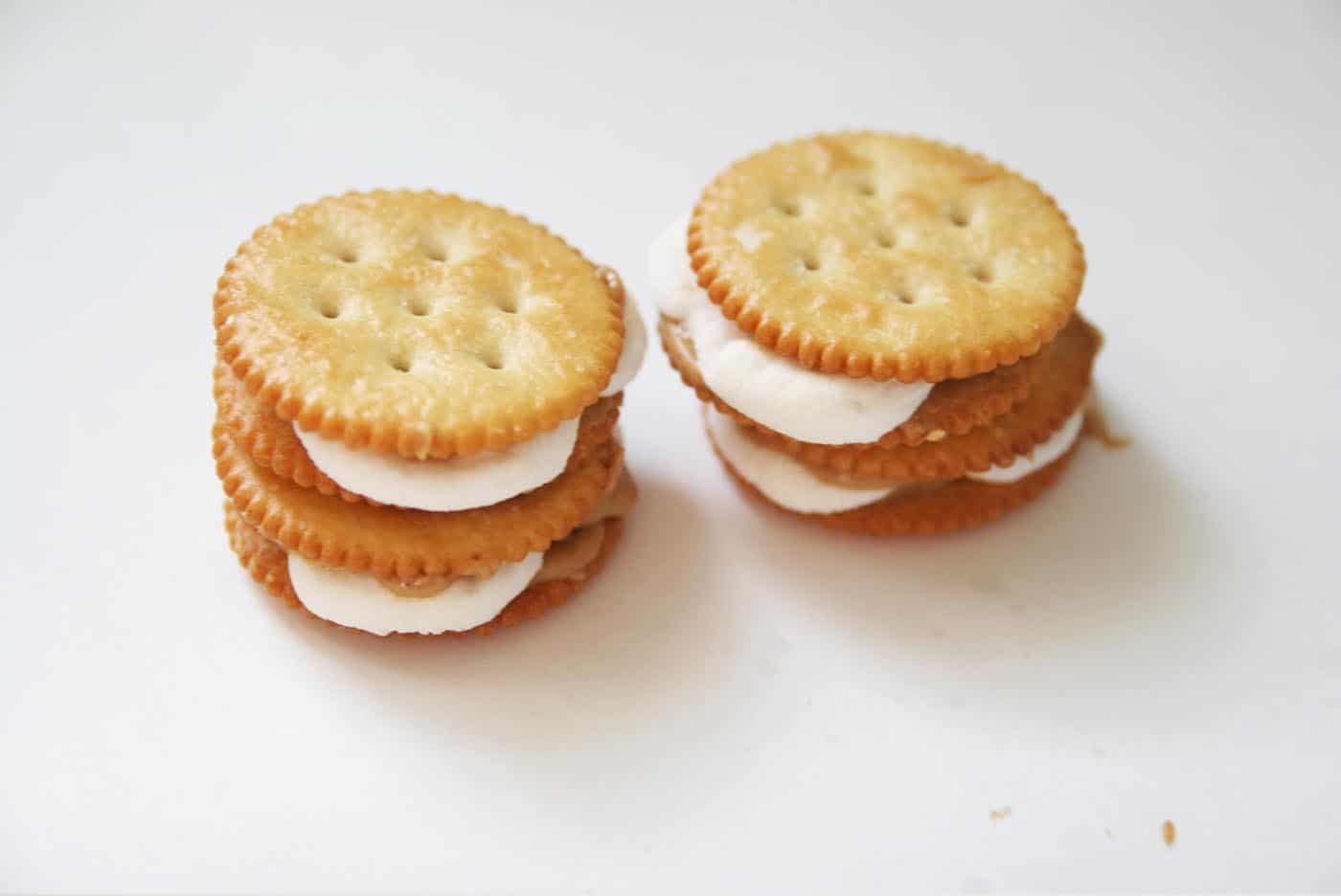 melted marshmallows sandwiched between ritz crackers