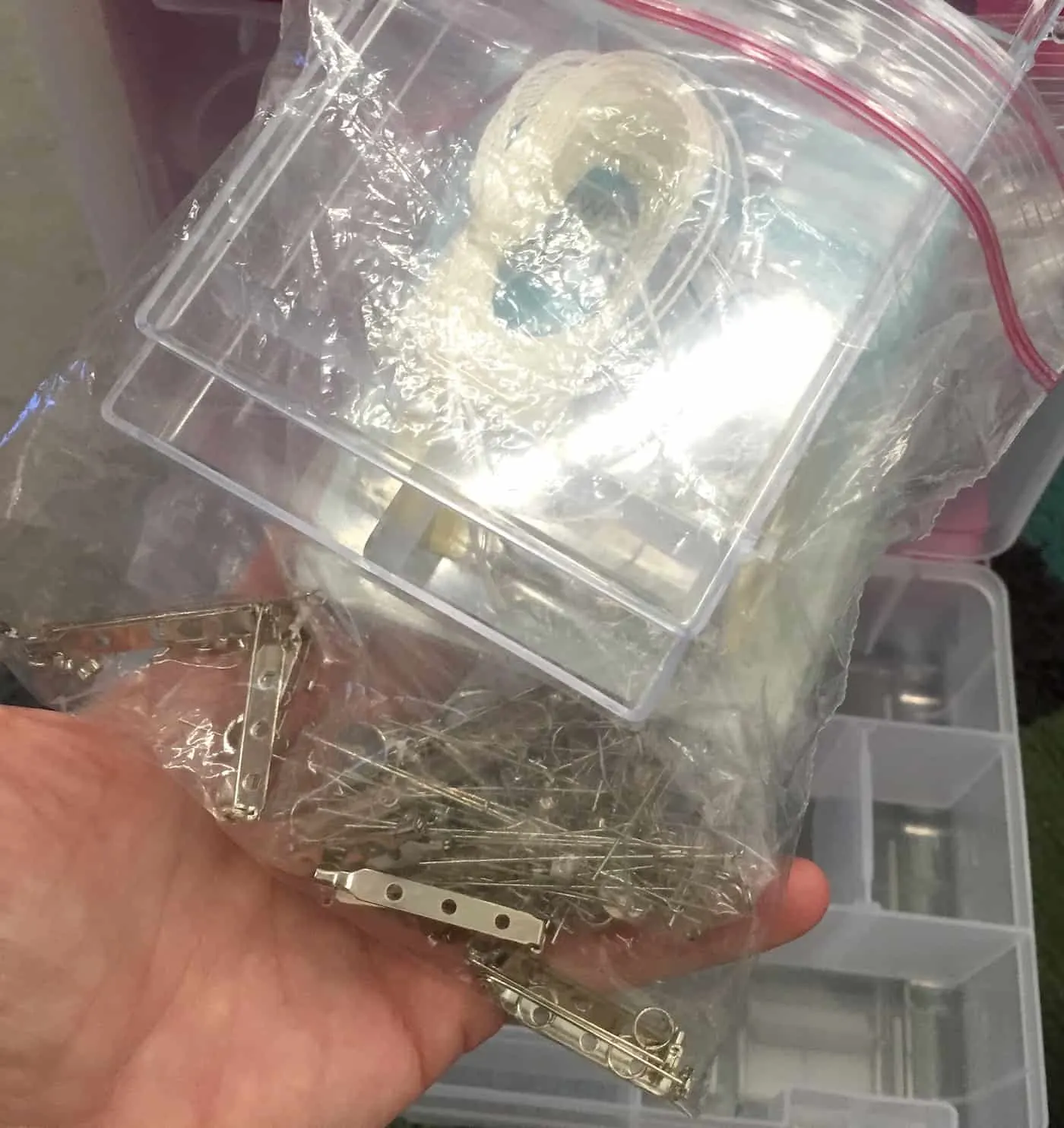 Random metal jewelry findings in a clear plastic bag