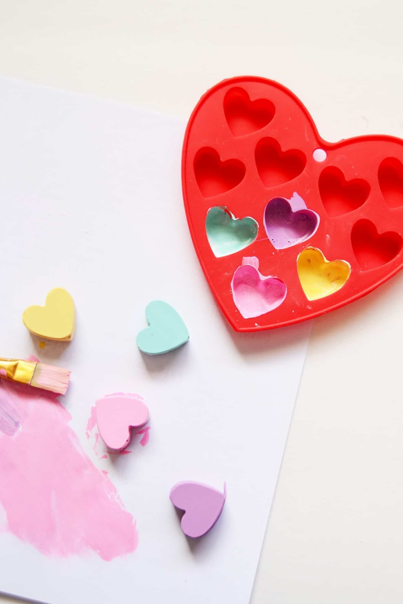 Painting the plaster hearts with pastel paint colors